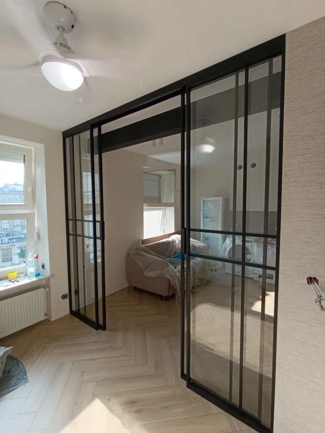 Steel and glass screen for an interior scheme