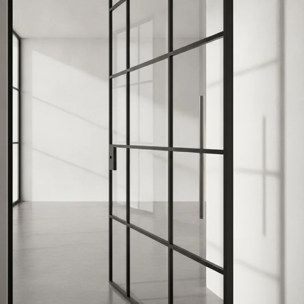 Slim black steel glazing bars with a long brushed steel door handle